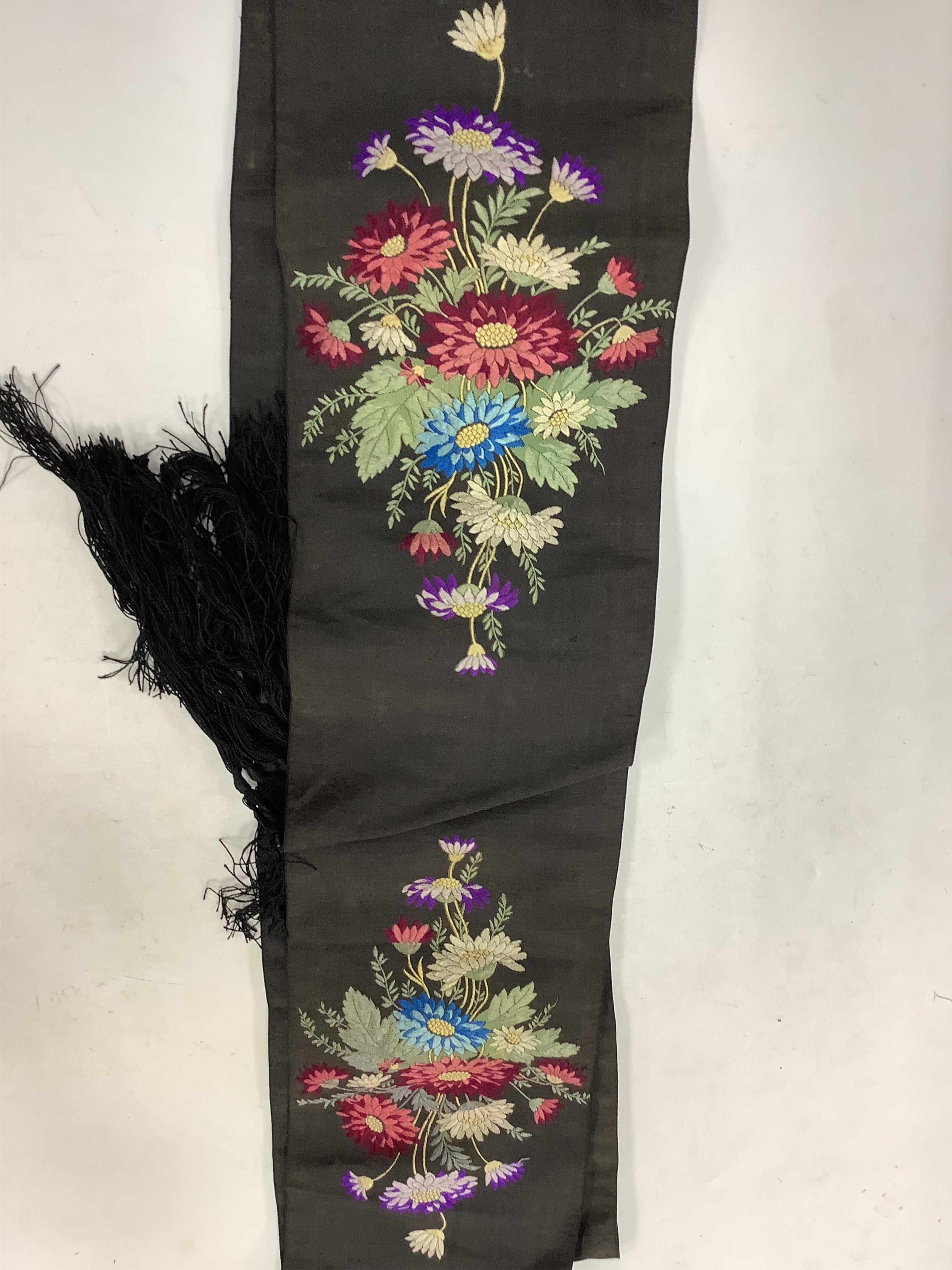 A collection of 19th century lace making patterns, a pair of 19th century kid leather and embroidered gloves, a small china doll in costume and an embroidered sash/ribbon - 210cm long, together with a silk woven lace pat